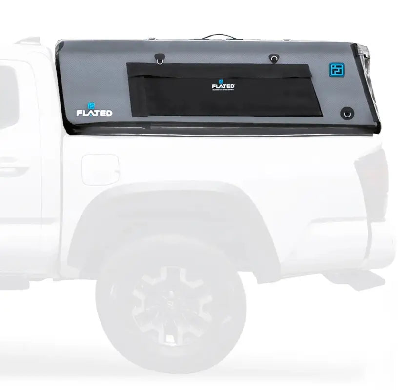 CAP Mid-Size 5' Bed Air-Topper installed on a white truck, showcasing its durable PVC material and secure attachment points.