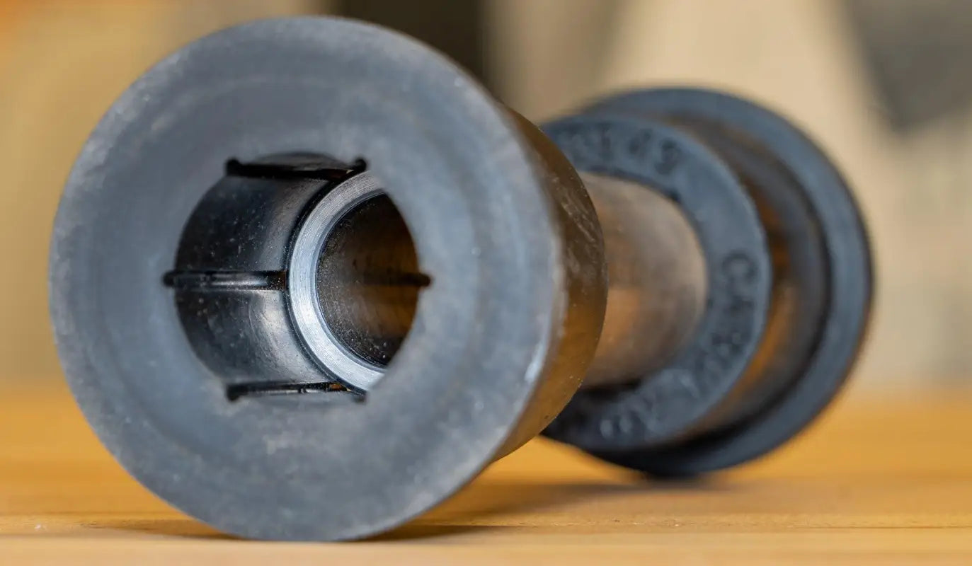 Black rubber bushing with central hole for leaf spring factory shackle in Carli Suspension truck parts