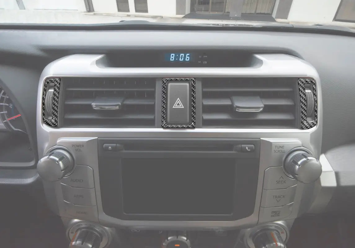 Center air vent accent trim with carbon fiber finish installed on a 2014-2024 Toyota 4Runner dashboard, enhancing interior aesthetics.