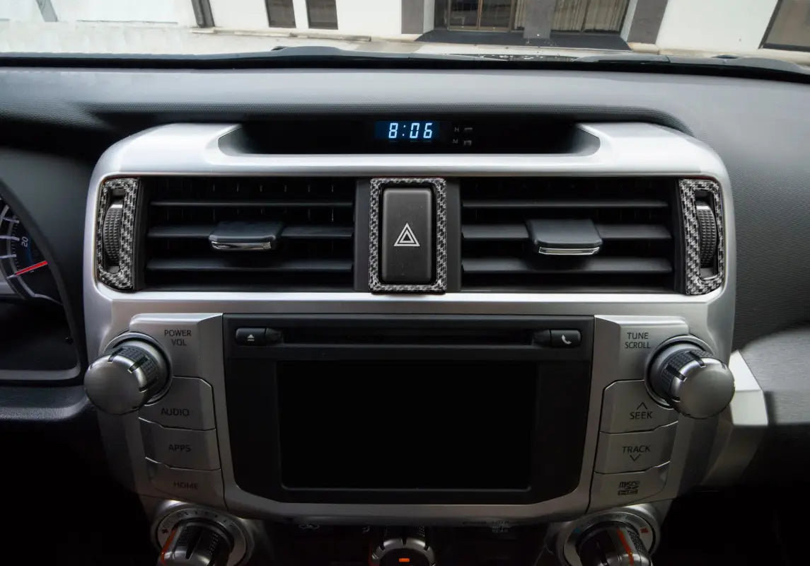 Close-up view of center air vent accent trim in carbon fiber design fitted on a Toyota 4Runner dashboard, compatible with 2014-2024 models.