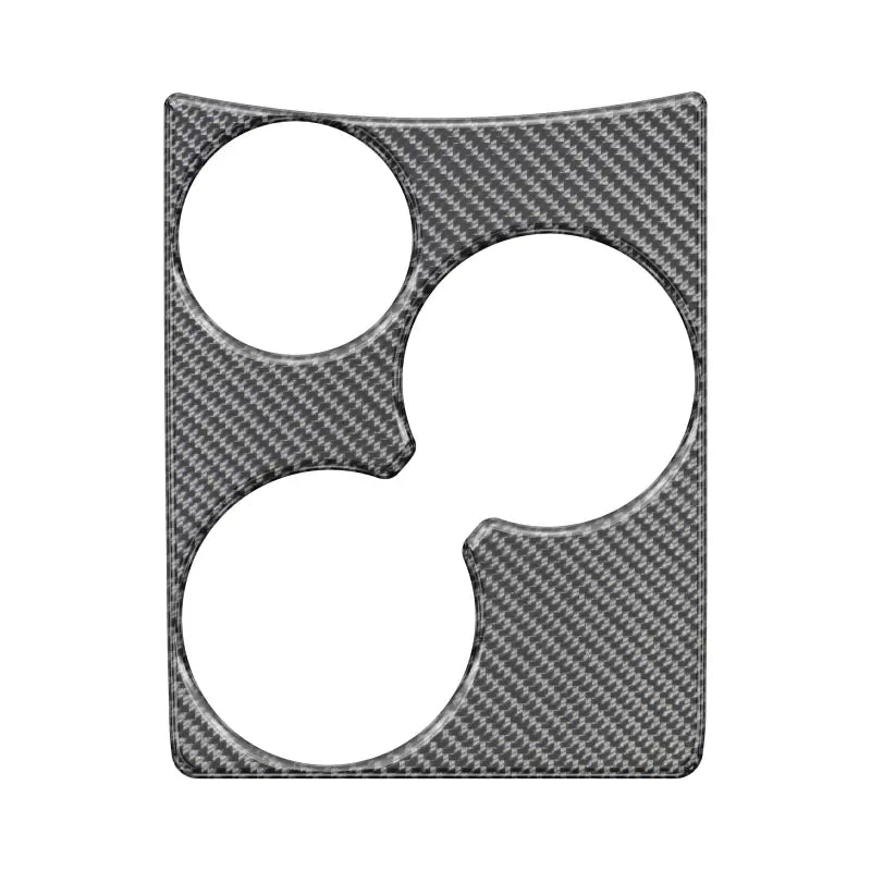 Cup holder accent overlay in carbon fiber style for 2005-2015 Toyota Tacoma, offering a custom interior upgrade.