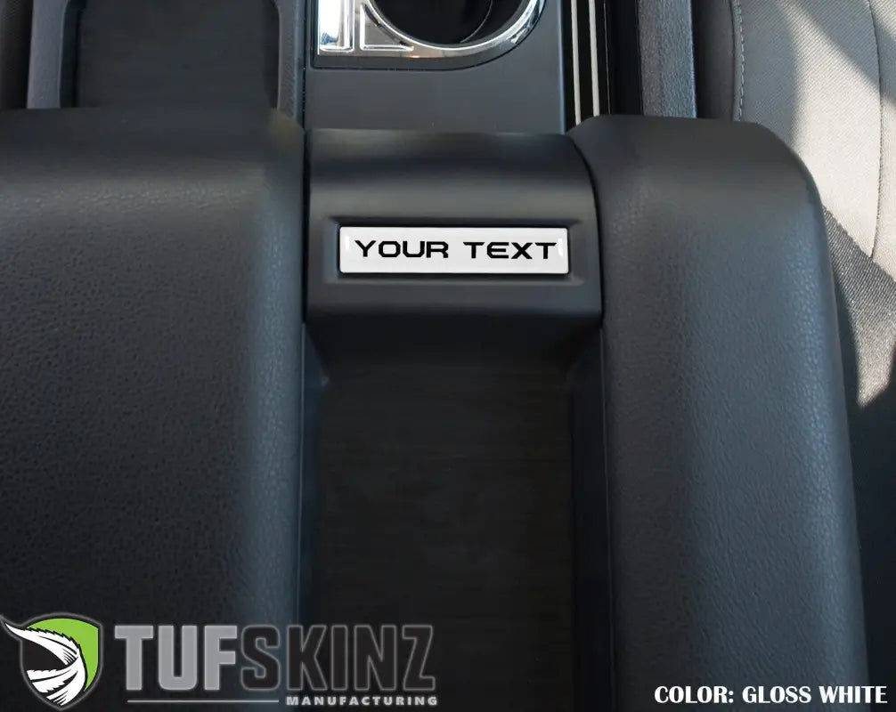 Center console badge in gloss white finish, customizable text, designed for 2014-2021 Toyota Tundra interior personalization.