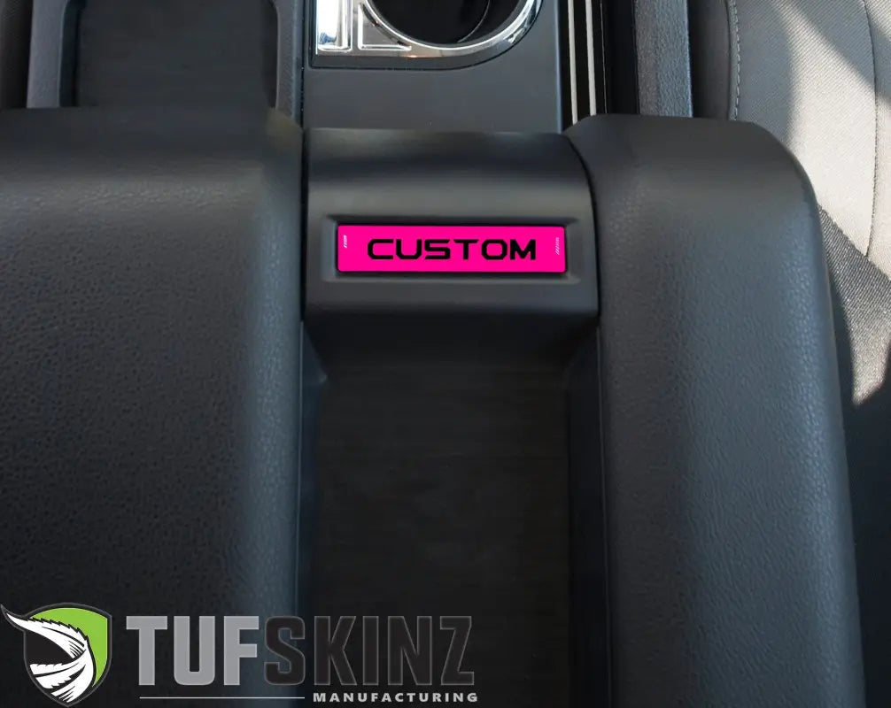Center console badge in hot pink finish, customizable text, compatible with 2014-2021 Toyota Tundra for bold interior decor.