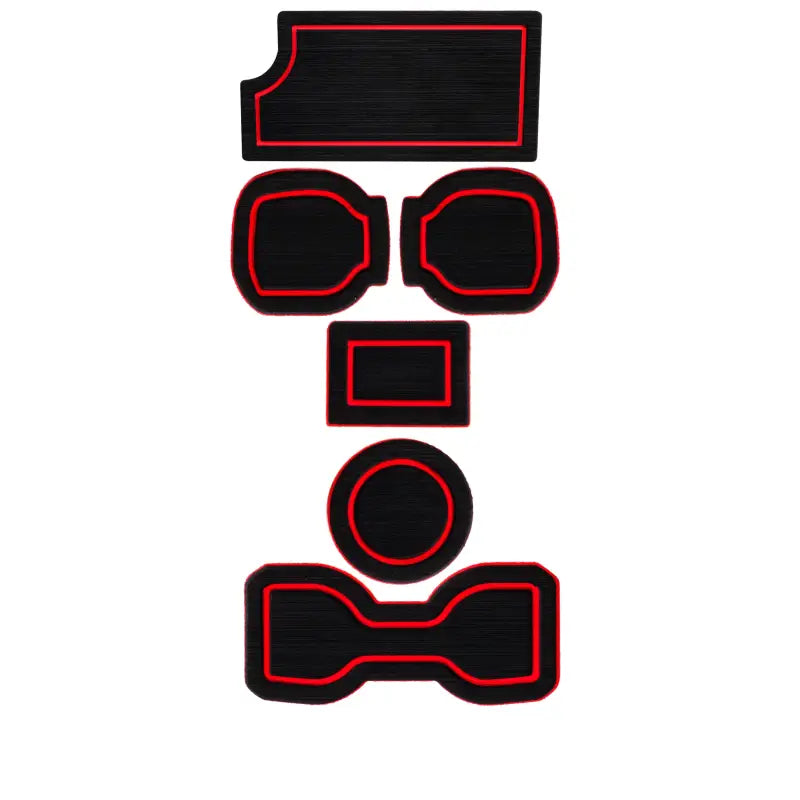 Complete set of black foam cup holder inserts with red accents for 2016-2023 Toyota Tacoma, highlighting custom-fit design.