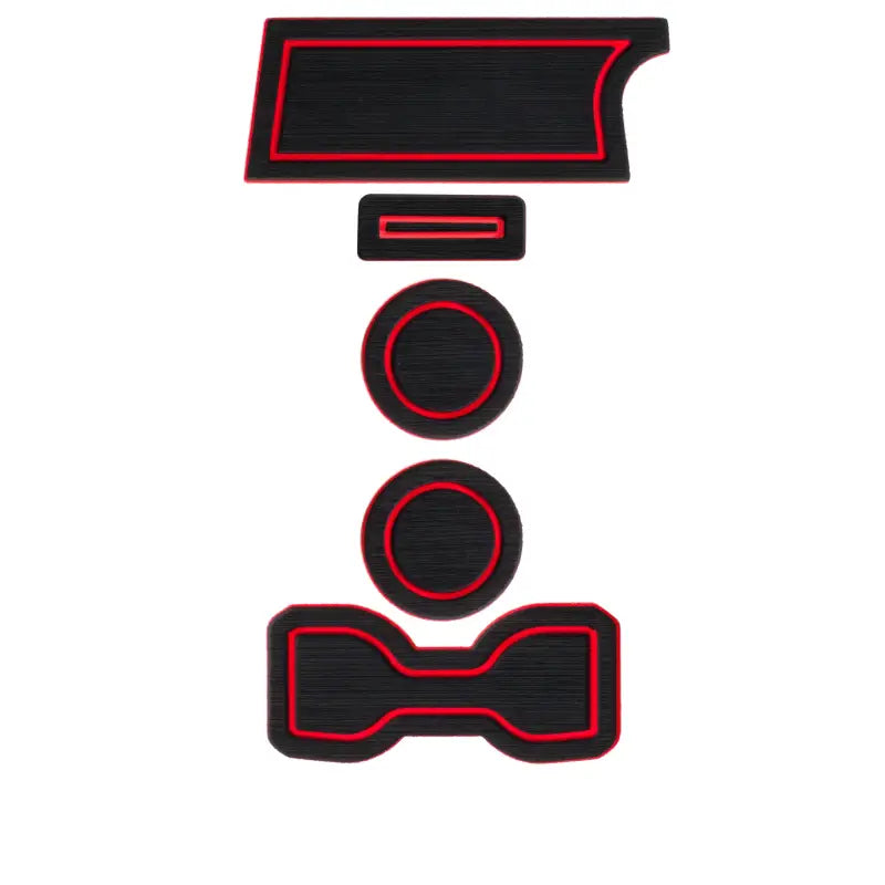Black foam cup holder inserts with red trim for Toyota Tacoma 2016-2023, shown in a compact arrangement for easy installation.