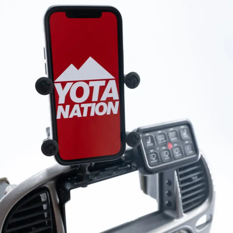 Sequoia dash accessory mount holding a phone with Yota Nation logo and a switch panel. Compatible with 2001-2007 models.