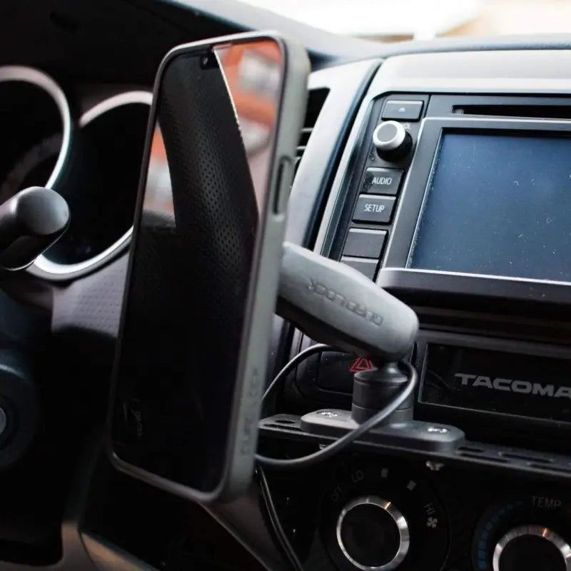 Tacoma modular accessory mount with a phone holder attached, positioned for easy access and visibility while driving.