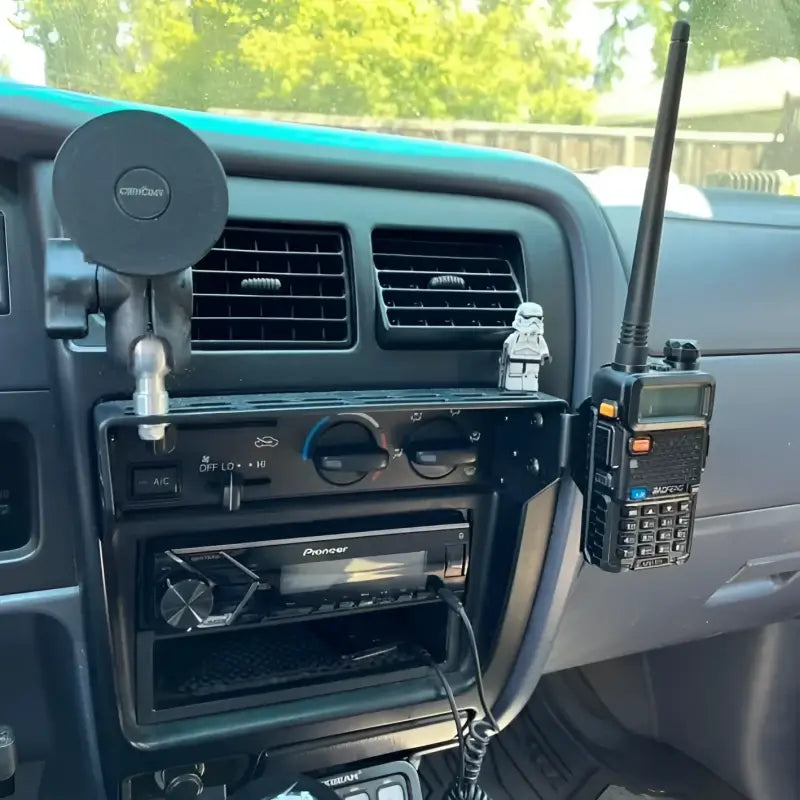 3rd Gen 4Runner console mount with a mounted radio and phone holder, highlighting its modular and durable design.