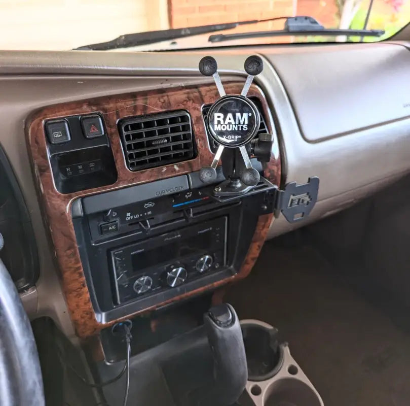 3rd Gen 4Runner console mount with RAM mount and radio installed, demonstrating versatile accessory compatibility.
