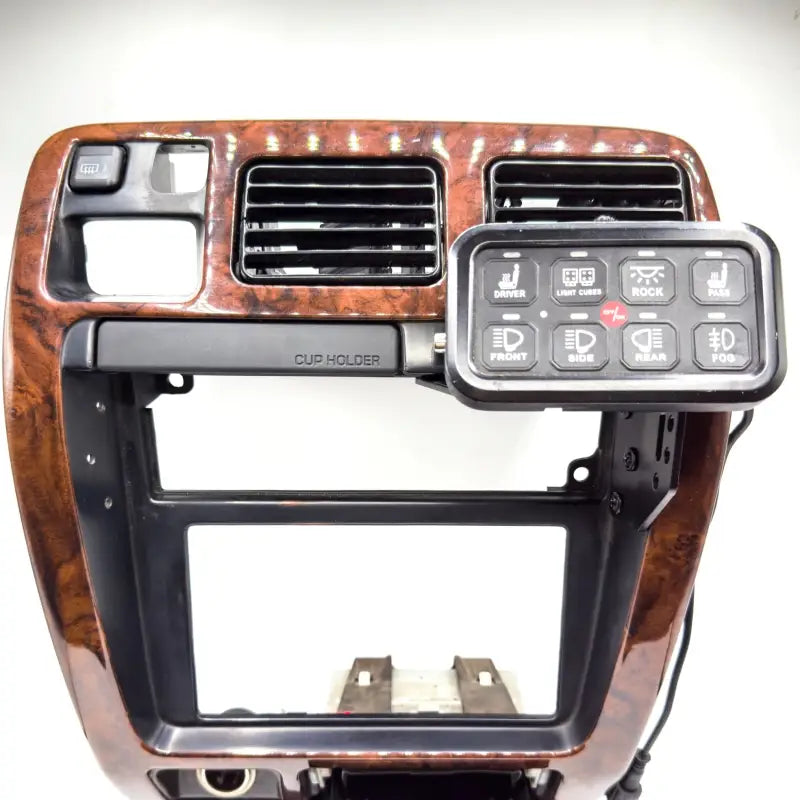 3rd Gen 4Runner console mount with a mounted switch panel, highlighting its practical and durable design.
