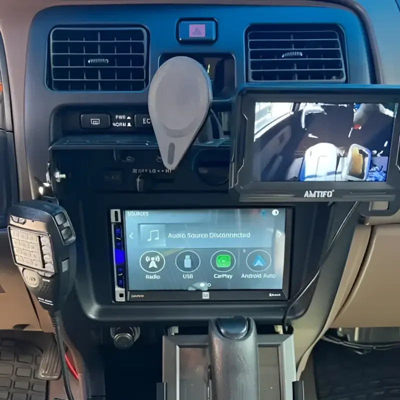 3rd Gen 4Runner console mount with a mounted phone and switch panel, showcasing its modular and practical design.