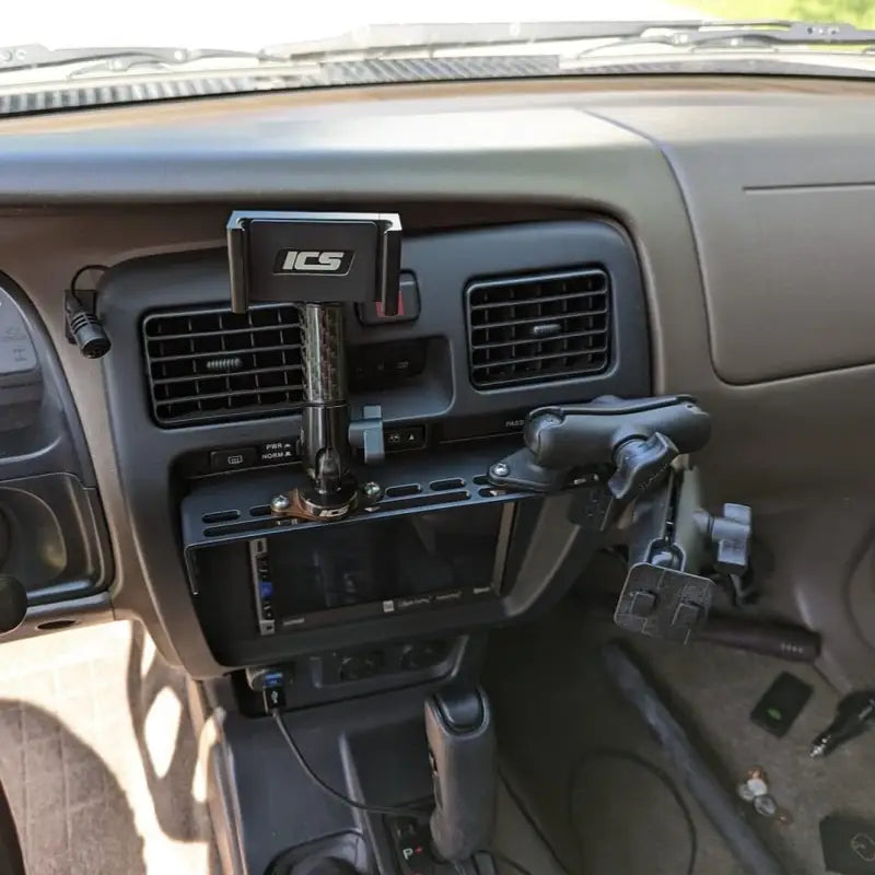 3rd Gen 4Runner console mount with multiple accessory mounts, including phone and radio holders, for enhanced usability.
