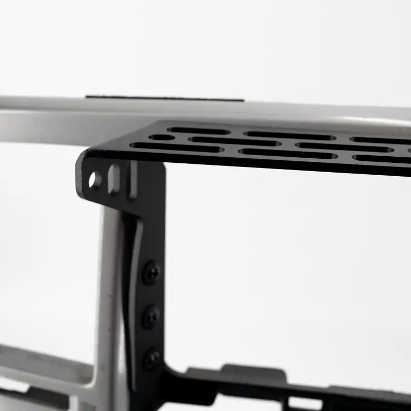 Close-up of 4th Gen 4Runner modular dash mount, showing its durable aluminum construction and mounting holes for accessories.