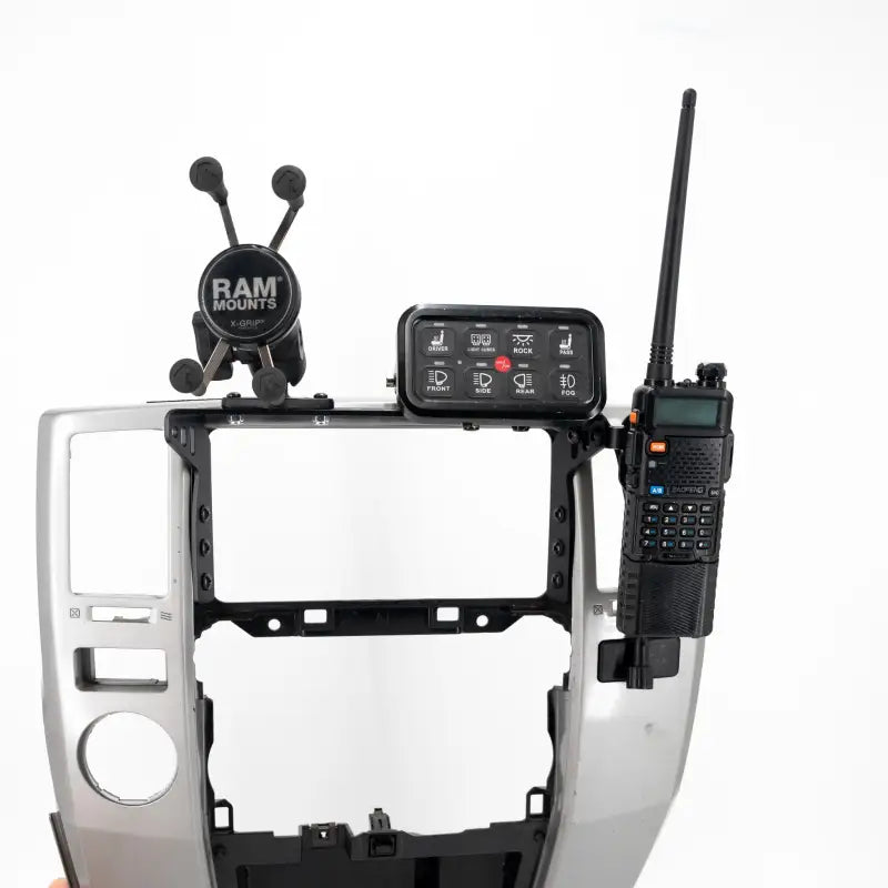 4th Gen 4Runner modular dash mount with RAM Mount and walkie-talkie attached, showcasing its versatile accessory compatibility.