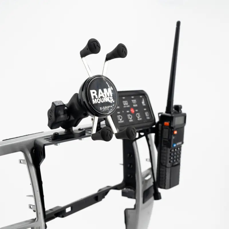 4th Gen 4Runner modular dash mount with RAM Mount and walkie-talkie attached, ideal for phones, GPS, and communication devices.
