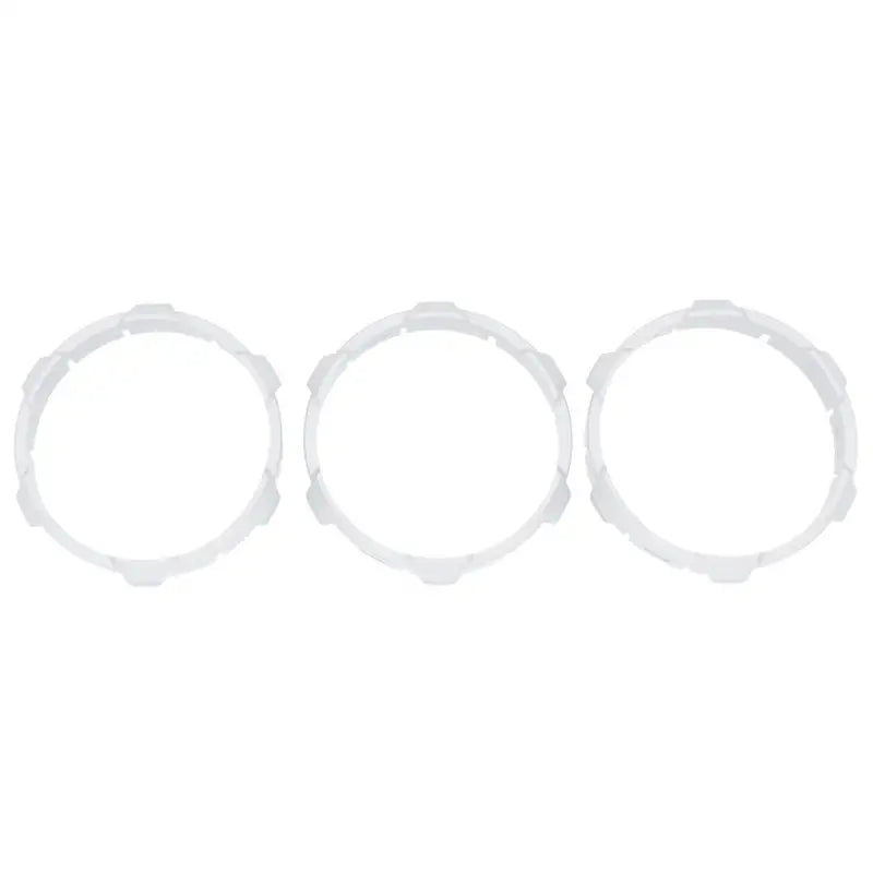 White climate control ring inserts for 2016-2023 Toyota Tacoma, compatible with manual and digital versions.