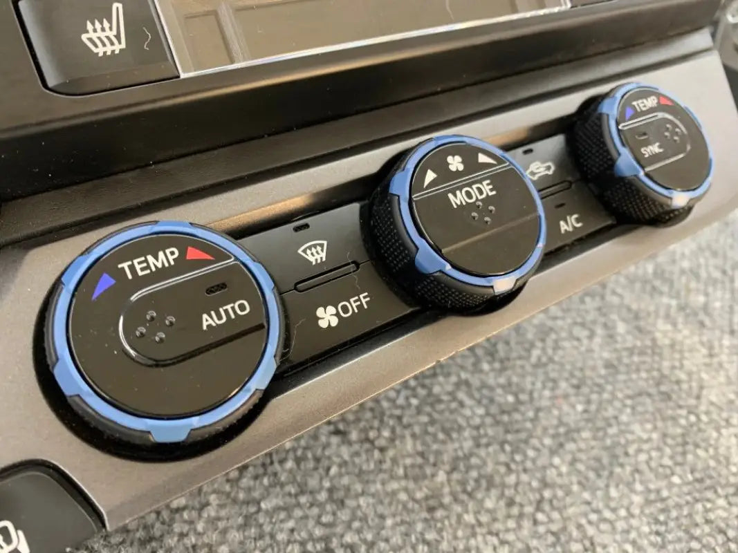 Green climate control ring inserts for 2016-2023 Toyota Tacoma, compatible with manual and digital versions.