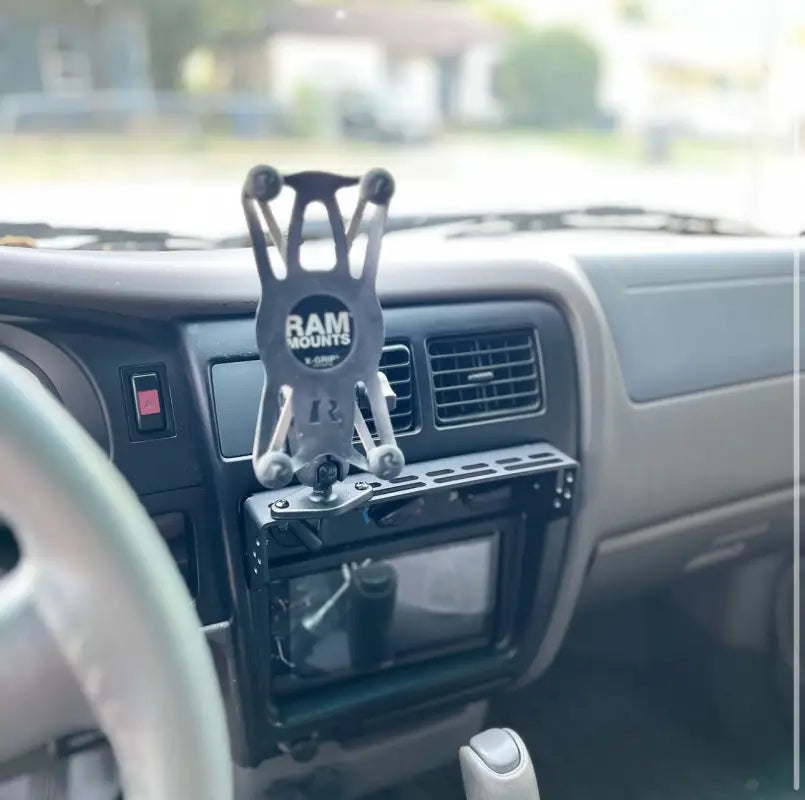 Tacoma modular console mount fitted with a RAM mount accessory, showcasing compatibility with 98-04 Toyota models.