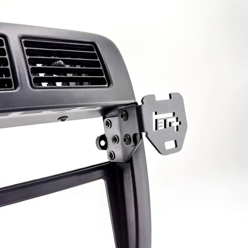 Close-up of Tacoma modular console mount with accessory attachment point, highlighting durable construction for 98-04 models.