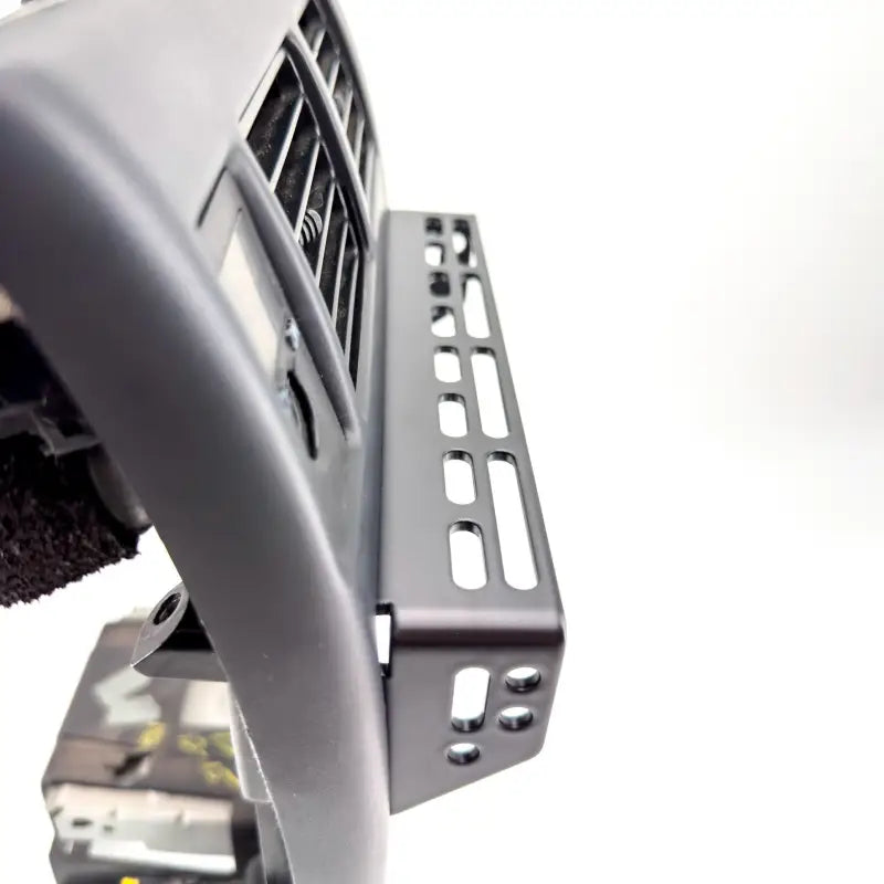 Side view of Tacoma modular console mount with precision laser-cut slots, designed for easy installation on 98-04 models.