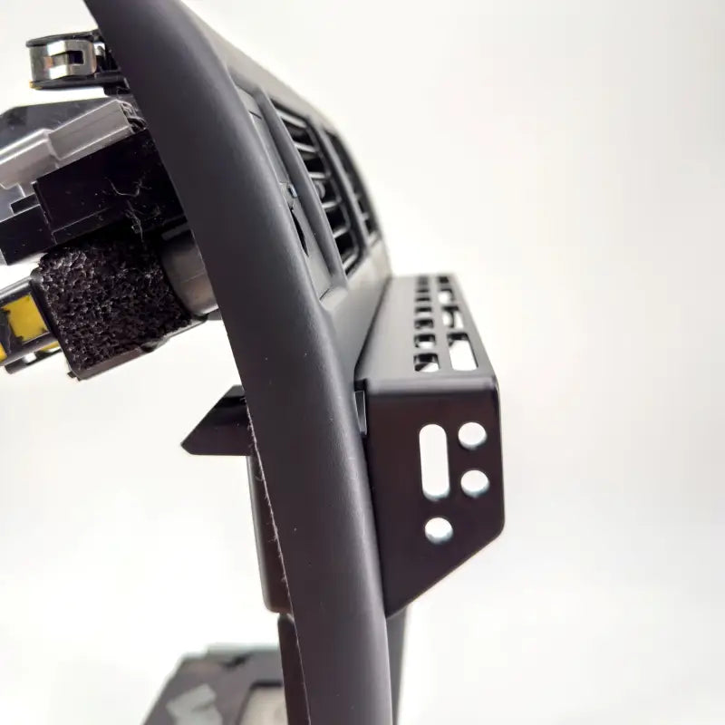 Side profile of Tacoma modular console mount, highlighting lightweight design and multiple mounting slots for 98-04 dashboards.
