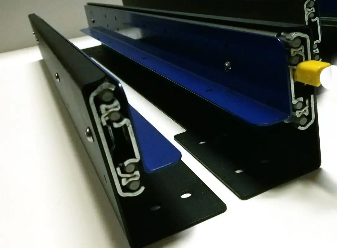 Detailed view of DIY slide tracks with black and blue components, highlighting the heavy-duty sliding mechanism.