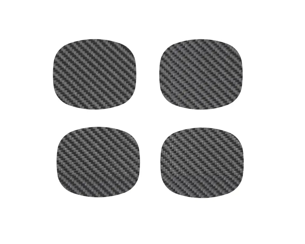 Set of four carbon fiber-style door handle protective inserts for Toyota Tacoma models from 2005-2015 and 2024-up.