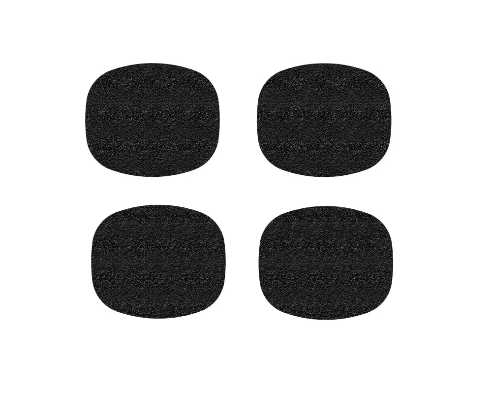 Set of four black textured door handle protective inserts for Toyota Tacoma models from 2005-2015 and 2024-up.