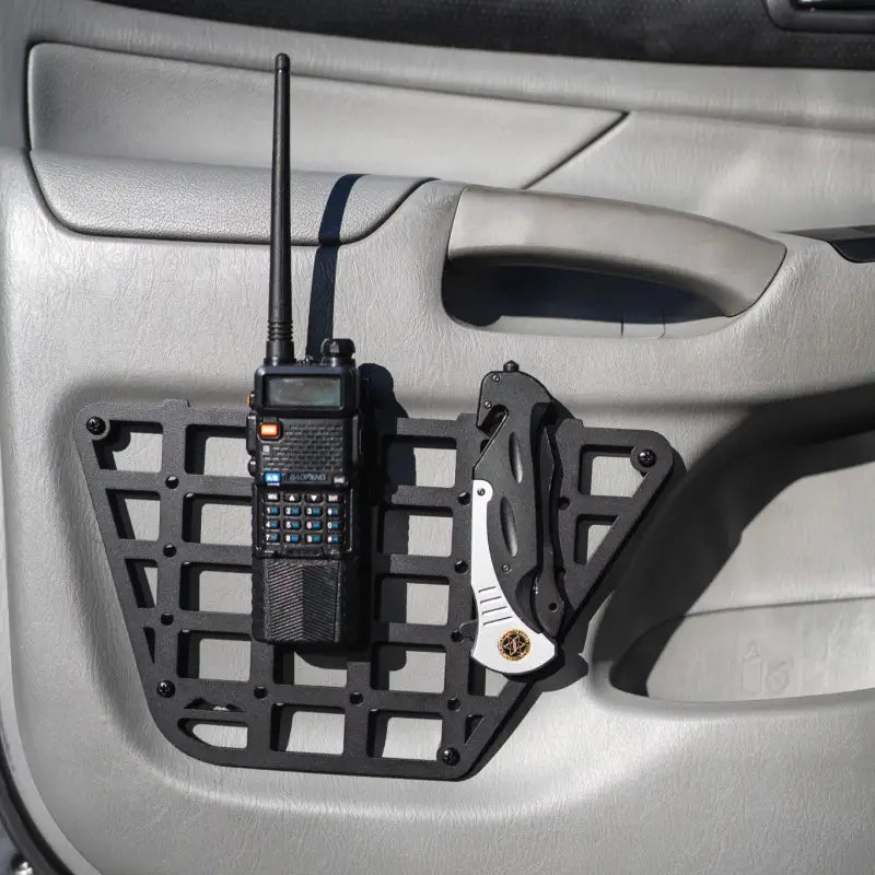 2nd Gen Tacoma molle panel featuring a mounted radio and knife, highlighting its practical use for 2012-2015 models.