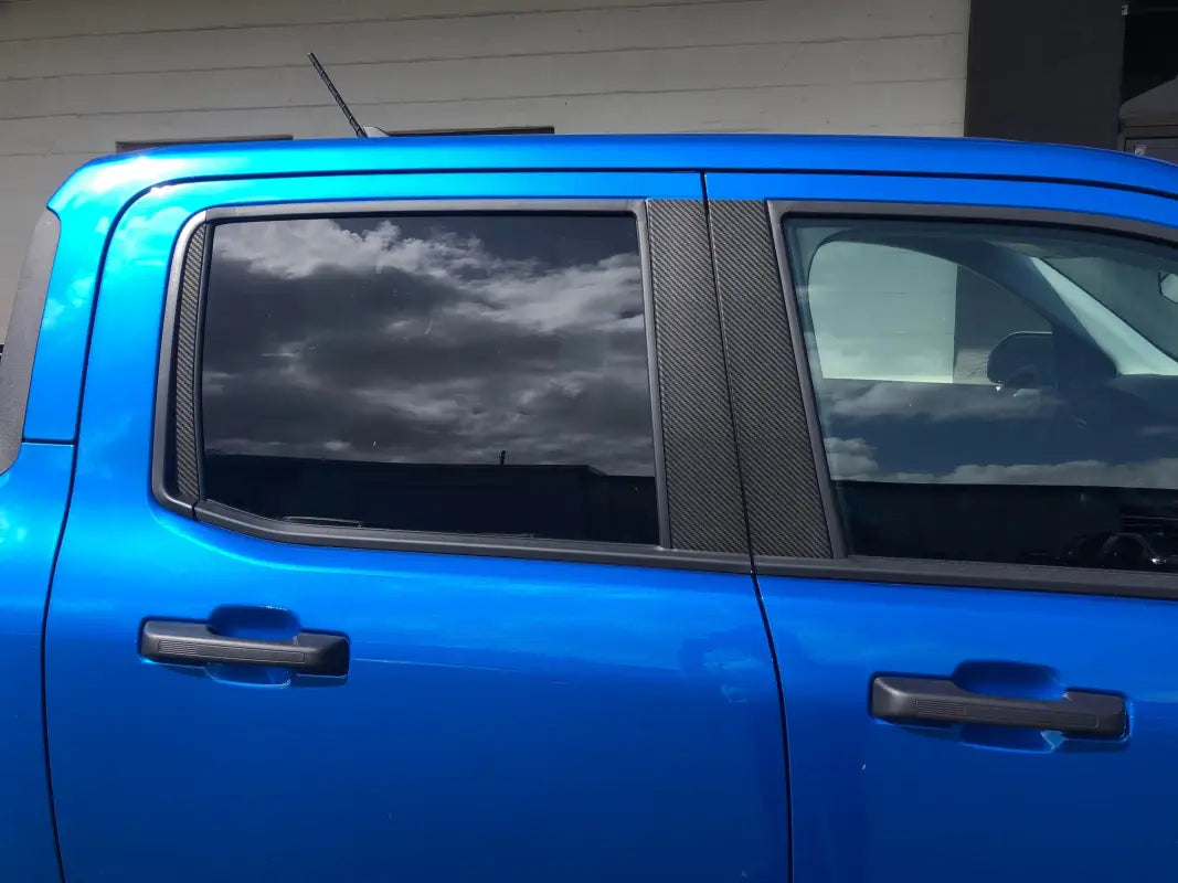Blue pickup truck side view with door pillar accent overlays for Ford Maverick