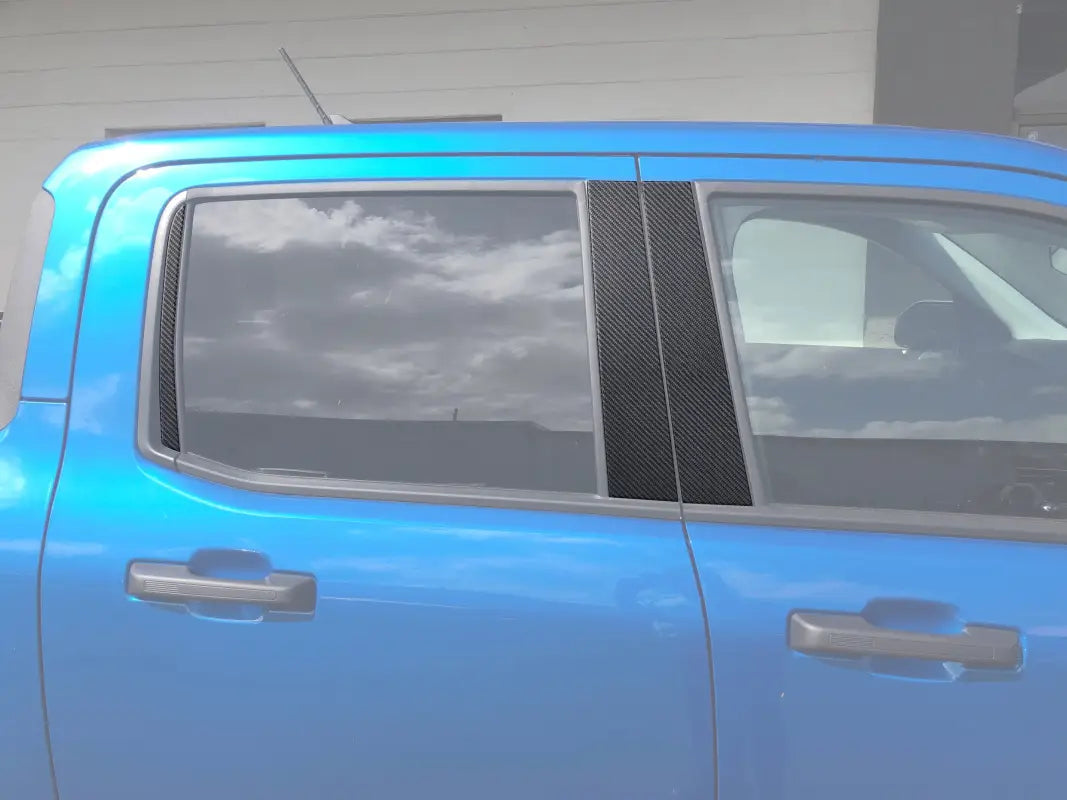 Blue pickup truck side view with door pillar accent overlays on Ford Maverick