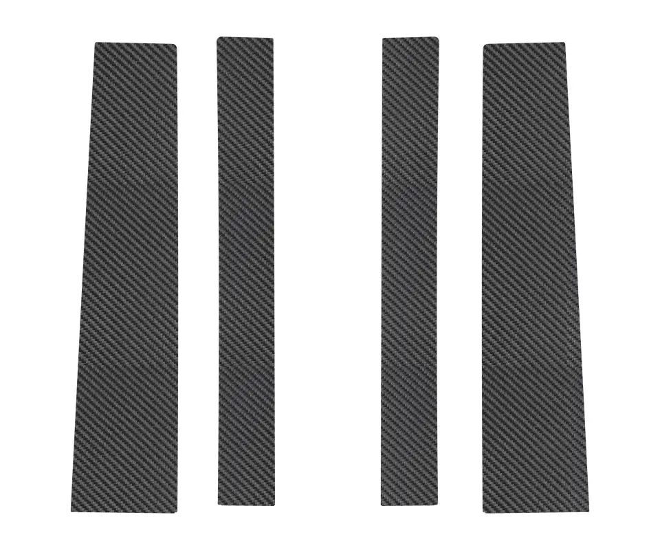 Set of four carbon fiber door pillar accent trims for Toyota FJ Cruiser, featuring a premium and sporty appearance.
