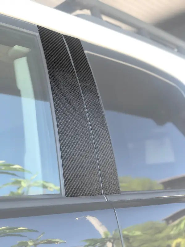 Textured black door pillar accent trim installed on a Toyota FJ Cruiser, showcasing a sleek and durable exterior upgrade.