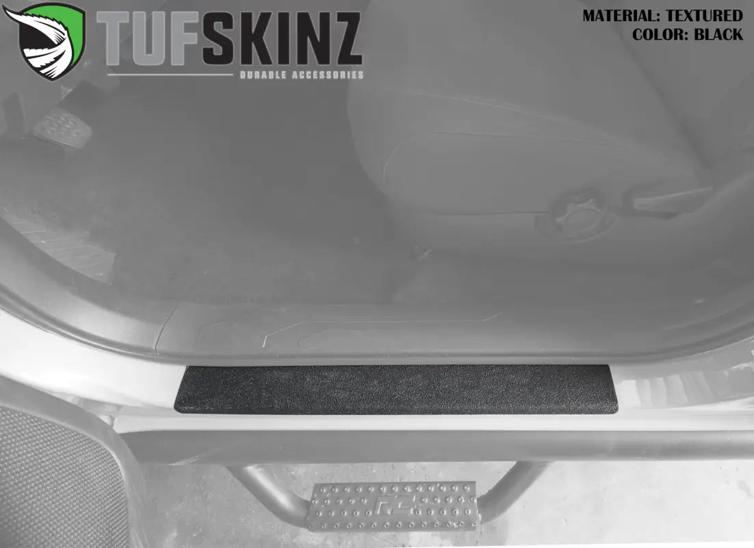Black textured door sill overlay for Toyota Tacoma 2005-2023, offering scratch protection and a sleek interior upgrade.