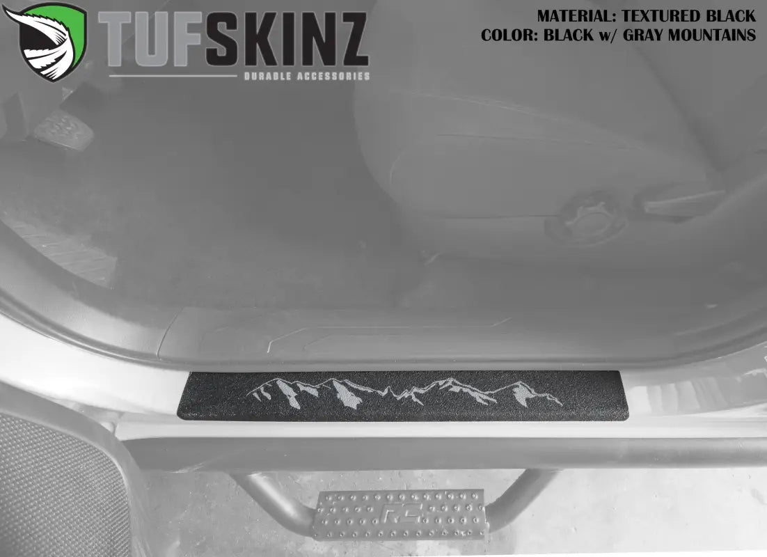 Gray mountain design on black textured door sill overlay for Toyota Tacoma 2005-2023, enhancing interior aesthetics and durability.
