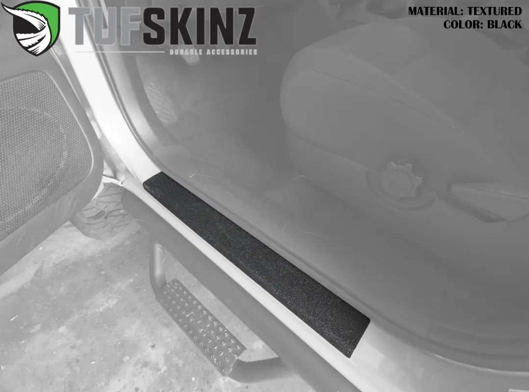 Black textured door sill protection overlay for 2005-2023 Toyota Tacoma, designed for durability and interior enhancement.
