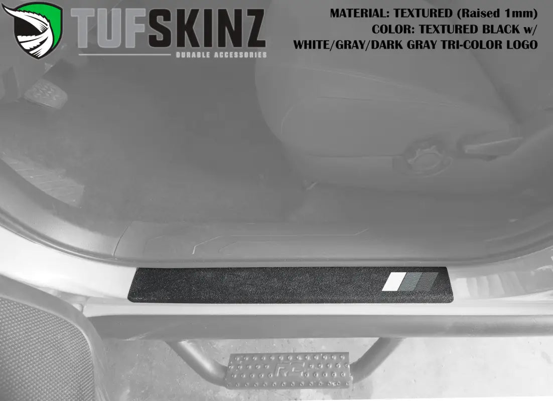 Textured black door sill overlay with white, gray, and dark gray tri-color logo for 2005-2023 Toyota Tacoma, raised for added style.