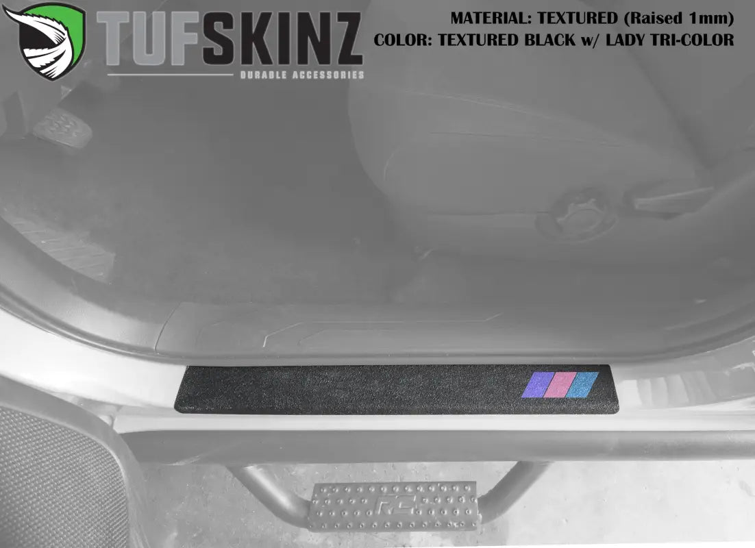 Textured black door sill overlay with lady tri-color design for 2005-2023 Toyota Tacoma, featuring a raised, colorful accent.