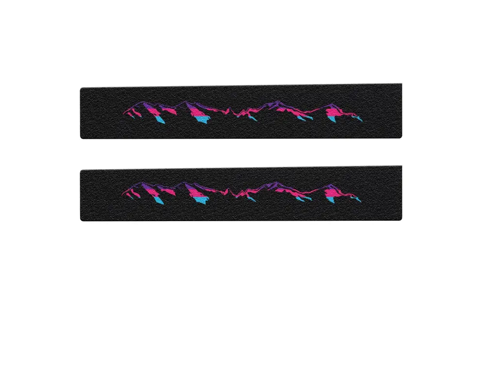 Black textured door sill overlays with pink and blue mountain design for 2005-2023 Toyota Tacoma, vibrant and durable.