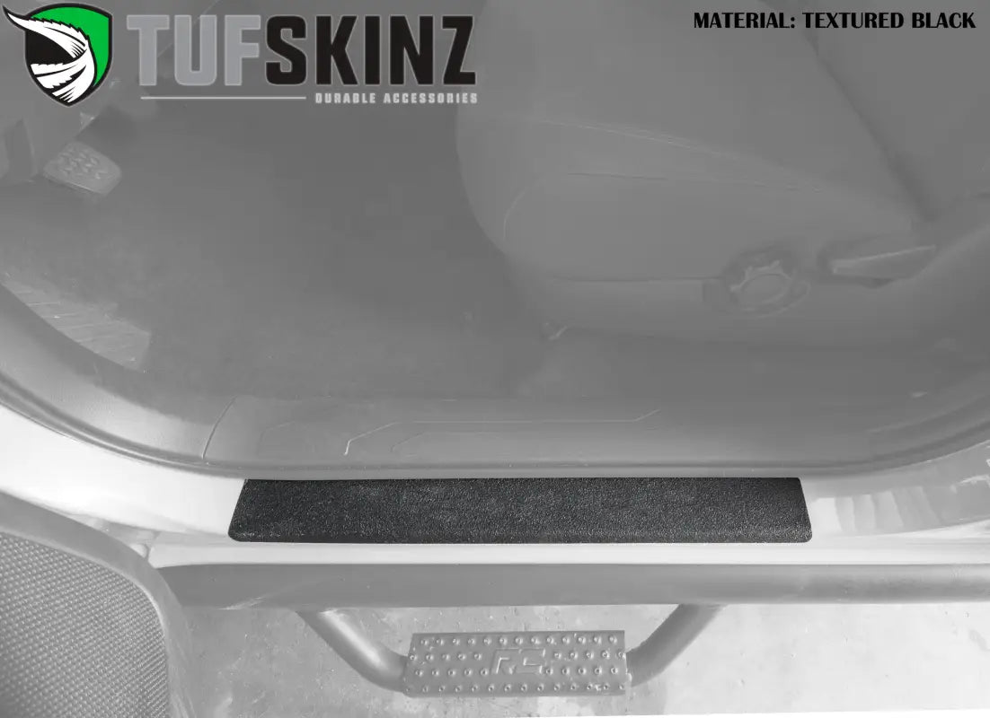 Black textured door sill overlay for 2005-2023 Toyota Tacoma, offering durable protection and a clean, minimalist design.