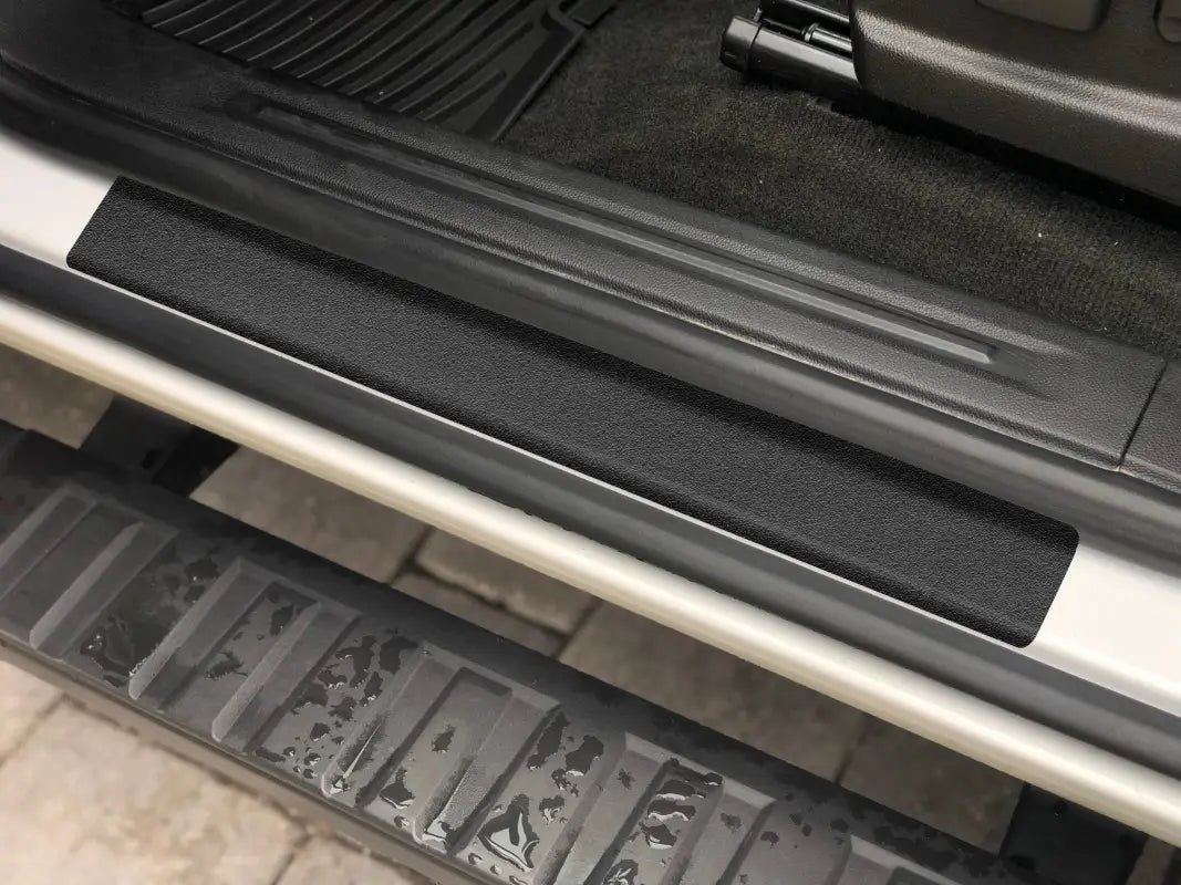 Textured black door sill protection overlay for Chevrolet Colorado 2015-2022