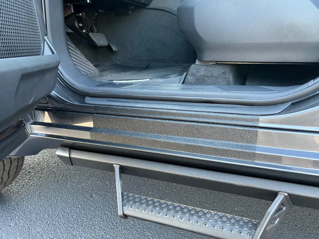 Black door sill overlay installed on a Toyota Sequoia, emphasizing its scratch-resistant surface and custom fit.