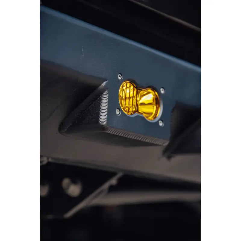 Detail of CNC-machined bezels with integrated Baja light mounting on the DRT high clearance rear bumper for 2005-2015 Tacoma.