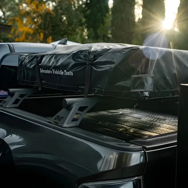 DRT Tacoma Lo-Pro Bedbars supporting a rooftop tent on a Toyota Tacoma, emphasizing below-roofline fit and adventure-ready design.