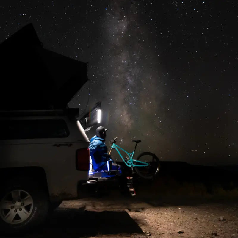 F-Series 40-inch Light on truck with rooftop tent and mountain bike under starry sky with add 360-degree rotation and red light effects