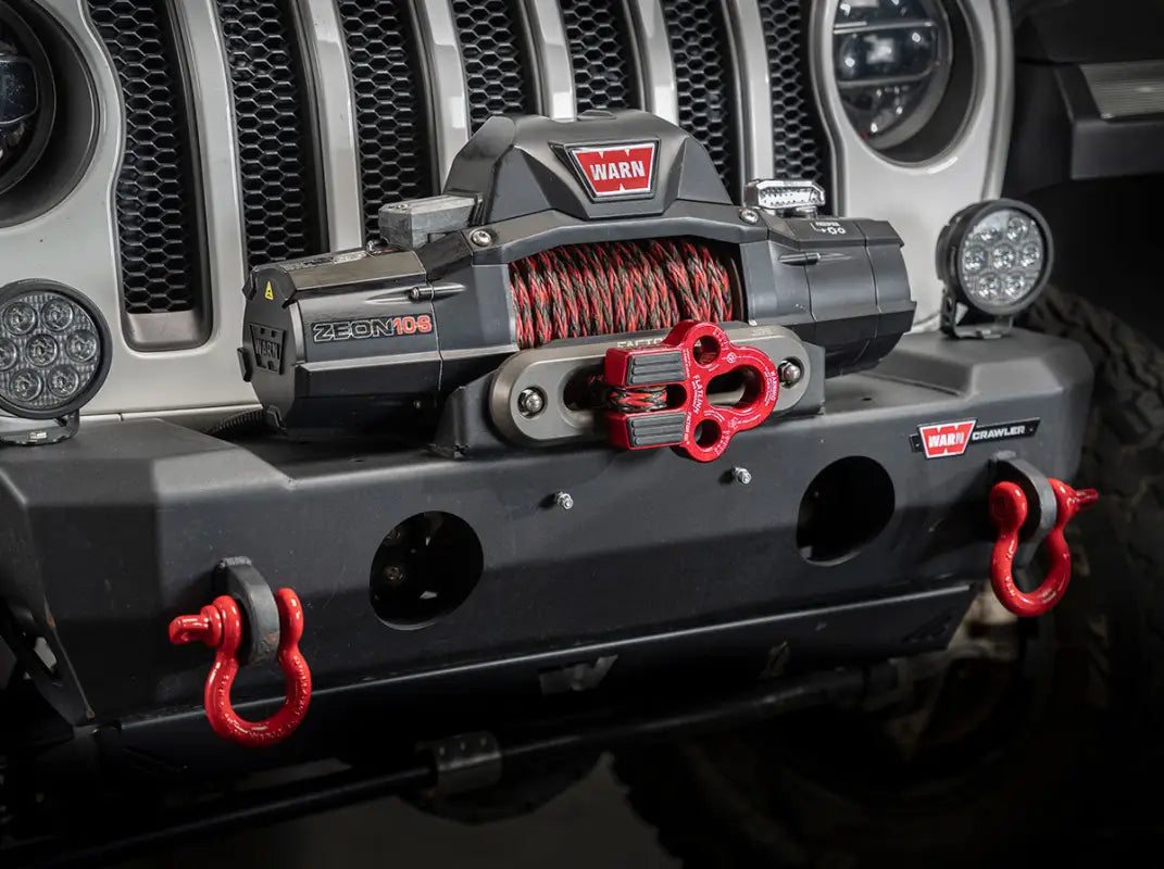 Red Factor 55 Flatlink Multimount mounted on a winch-equipped Jeep bumper, demonstrating its compatibility with off-road vehicles.