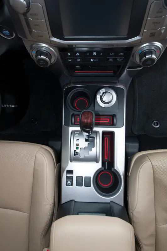 Close-up view of FOAM cup holder inserts fitted in a Toyota 4Runner center console, compatible with 2010-2024 models.
