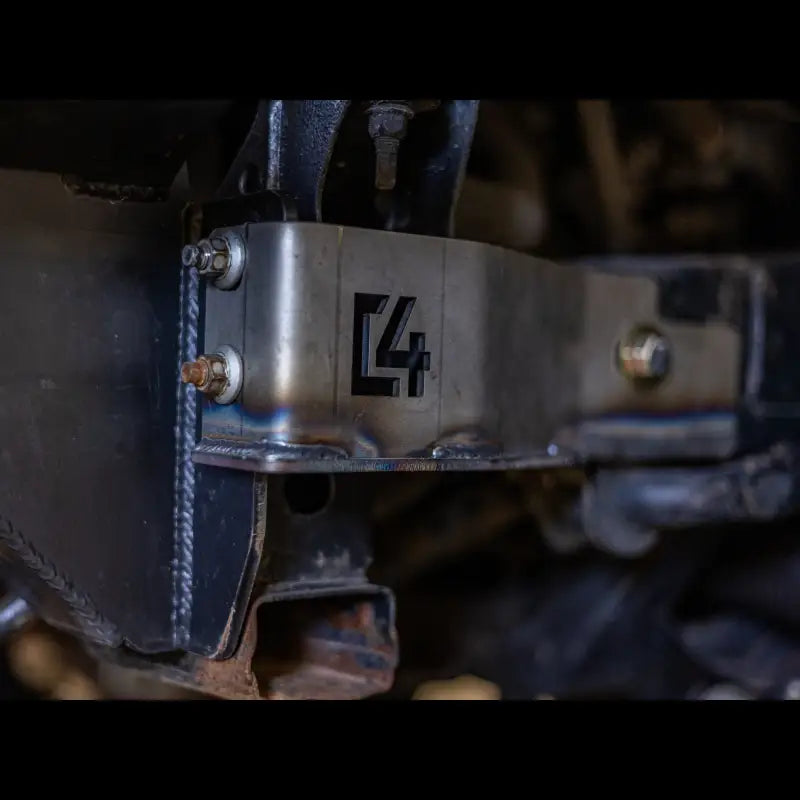 Detailed view of steel Tacoma front bumper bracket with C4 logo, offering bolt-on support for 2005-2015 models.