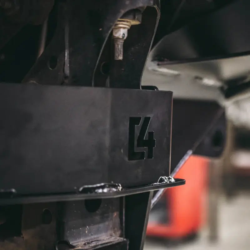 Tacoma front bumper bracket in black steel with C4 logo, designed for 2005-2015 models, providing durable bumper support.