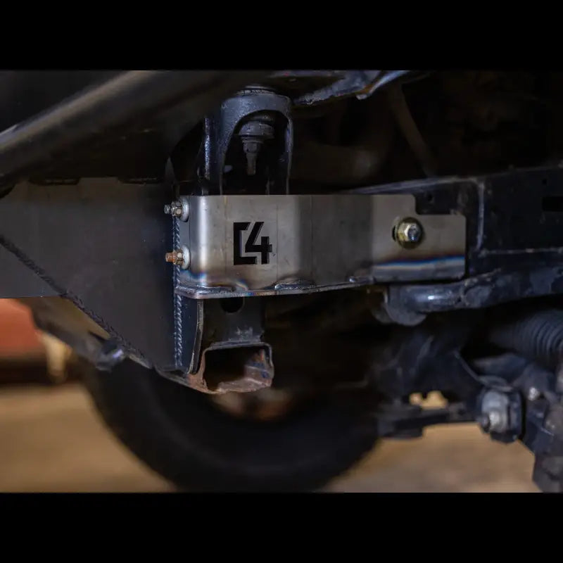 Close-up of Tacoma front bumper bracket in steel finish, featuring bolt-on installation and C4 logo for 2005-2015 models.